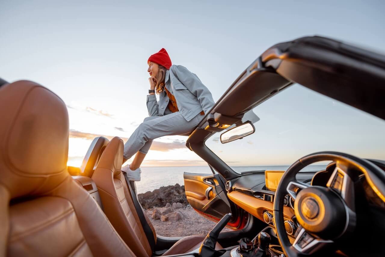 woman traveling by car on the rocky ocean coast 2025 03 15 04 02 00 utc.jpg